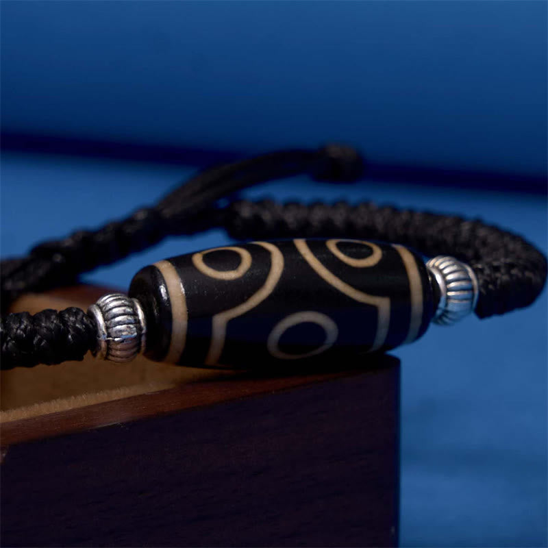 Bracelet en corde de protection de richesse Buddha Stones tibétaines à neuf yeux et à trois yeux