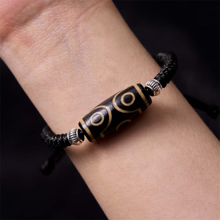 Bracelet en corde de protection de richesse Buddha Stones tibétaines à neuf yeux et à trois yeux