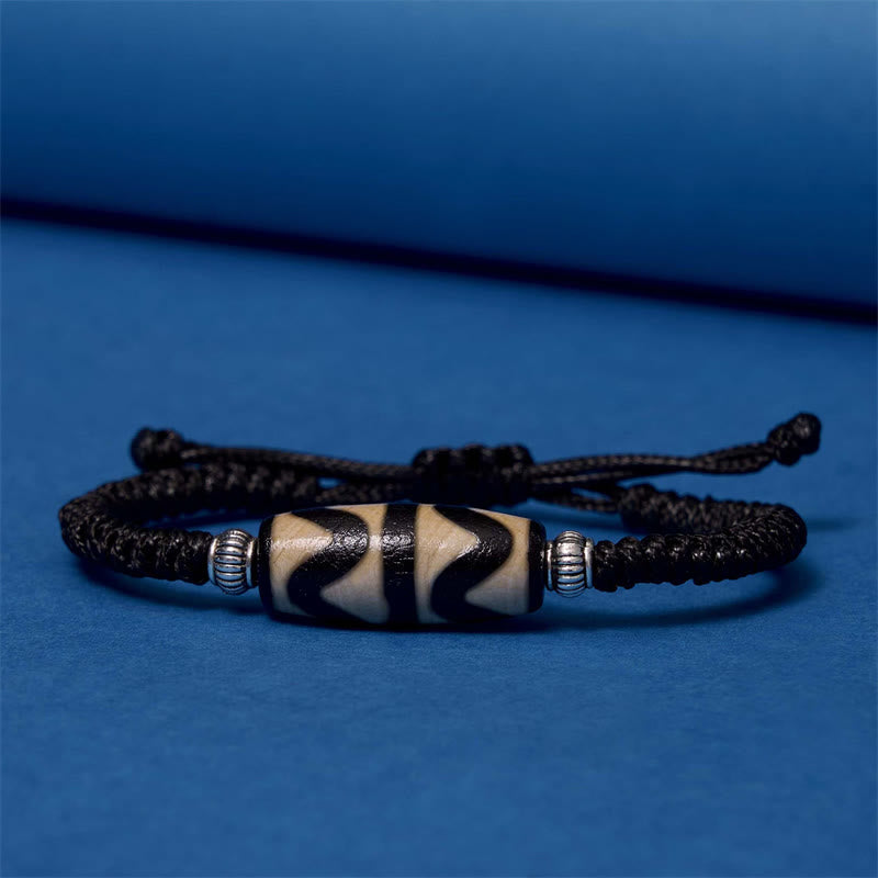 Bracelet en corde de protection de richesse Buddha Stones tibétaines à neuf yeux et à trois yeux