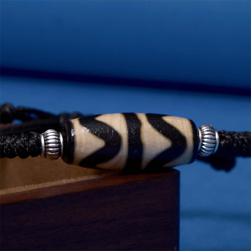 Bracelet en corde de protection de richesse Buddha Stones tibétaines à neuf yeux et à trois yeux