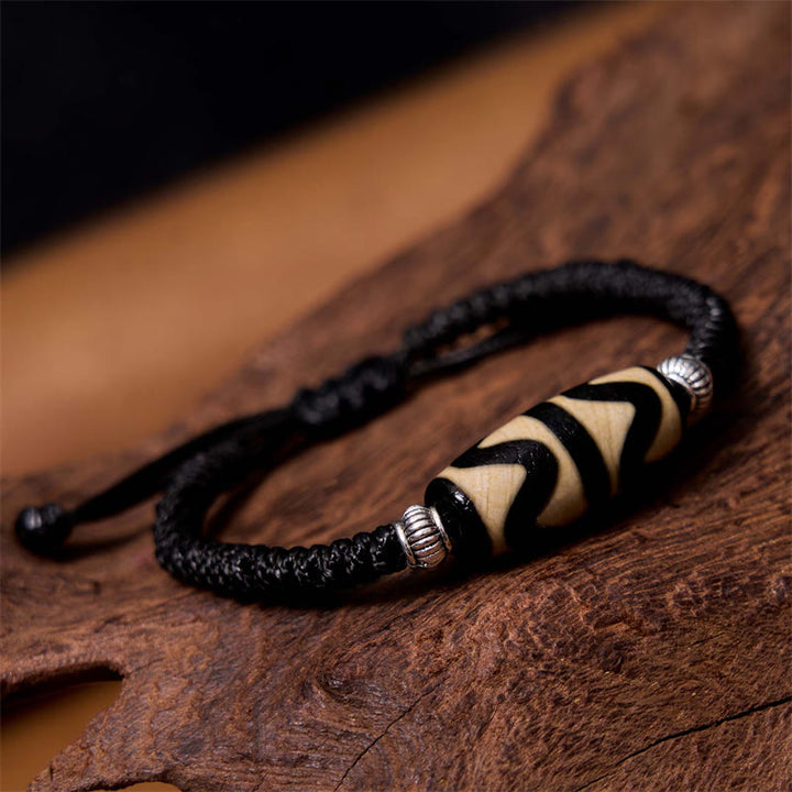 Bracelet en corde de protection de richesse Buddha Stones tibétaines à neuf yeux et à trois yeux
