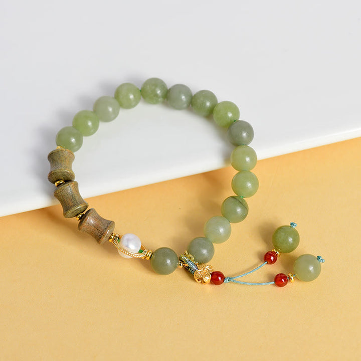 Bracelet de prospérité en jade, bois de santal, bambou et perles de Buddha Stones