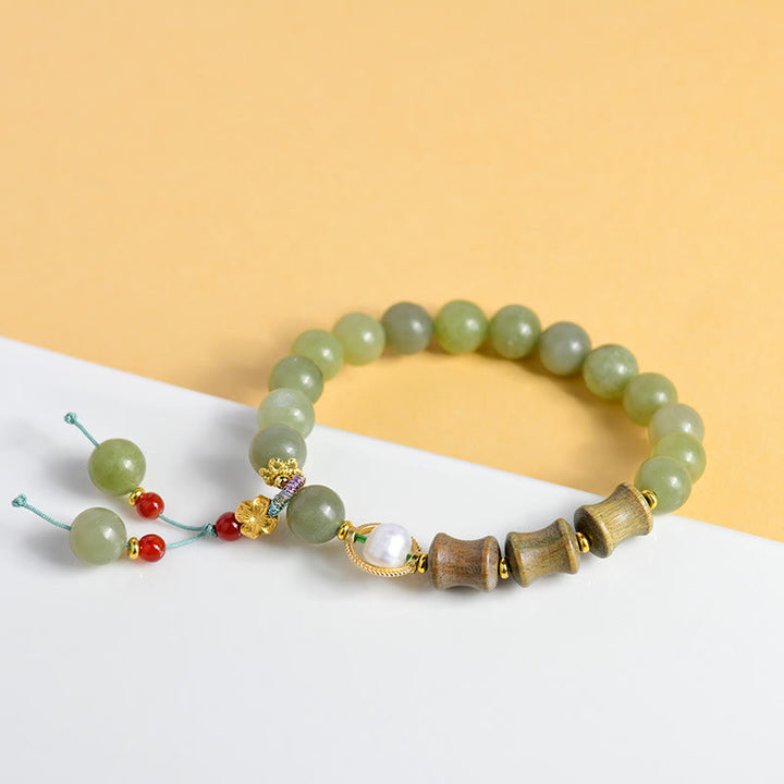 Bracelet de prospérité en jade, bois de santal, bambou et perles de Buddha Stones
