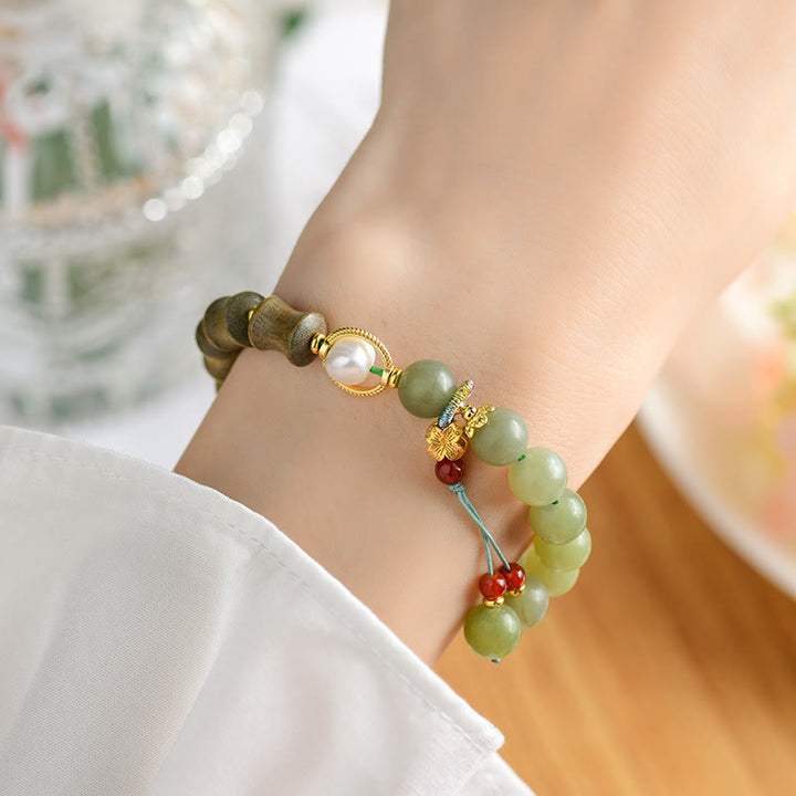 Bracelet de prospérité en jade, bois de santal, bambou et perles de Buddha Stones