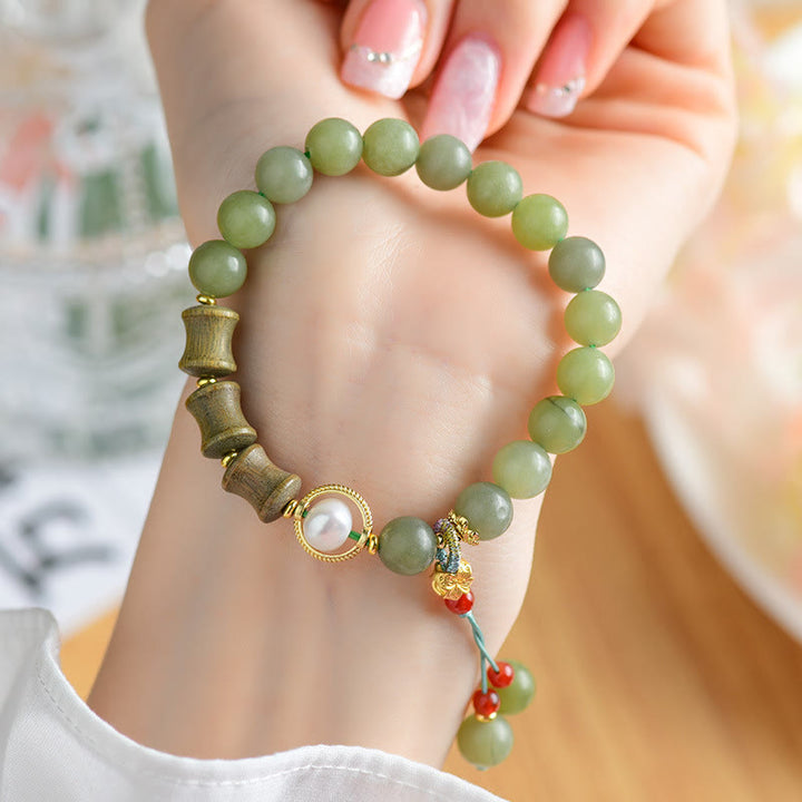 Bracelet de prospérité en jade, bois de santal, bambou et perles de Buddha Stones