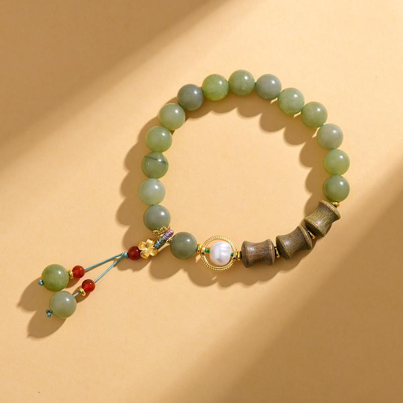 Bracelet de prospérité en jade, bois de santal, bambou et perles de Buddha Stones