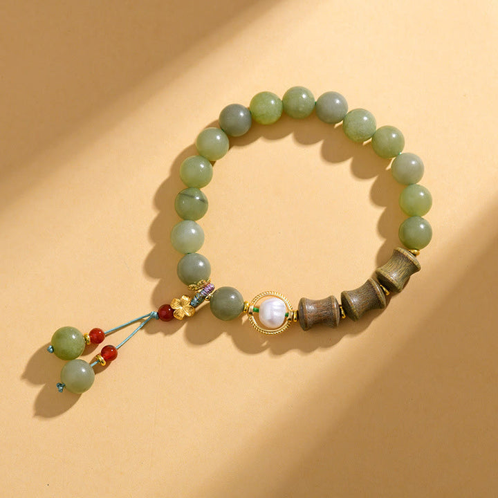 Bracelet de prospérité en jade, bois de santal, bambou et perles de Buddha Stones