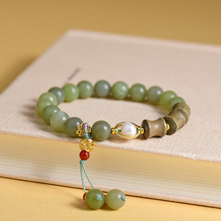 Bracelet de prospérité en jade, bois de santal, bambou et perles de Buddha Stones