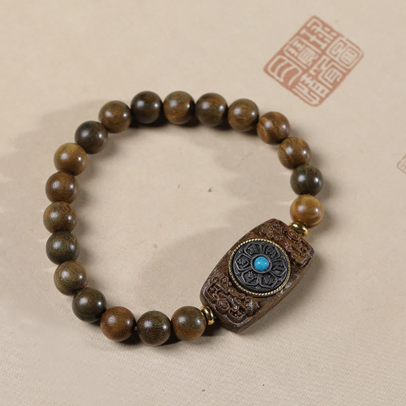 Bracelet de paix en six mots vrais en bois de santal rouge et vert avec petites feuilles de Buddha Stones