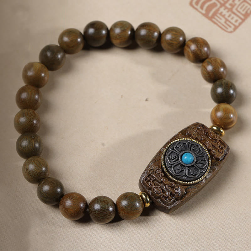 Bracelet de paix en six mots vrais en bois de santal rouge et vert avec petites feuilles de Buddha Stones