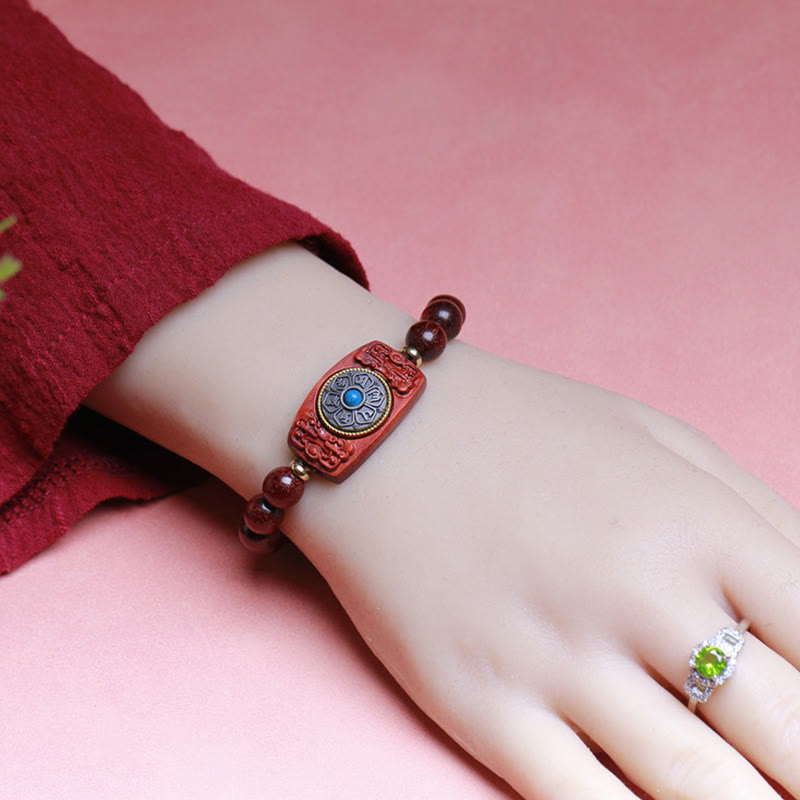 Bracelet de paix en six mots vrais en bois de santal rouge et vert avec petites feuilles de Buddha Stones