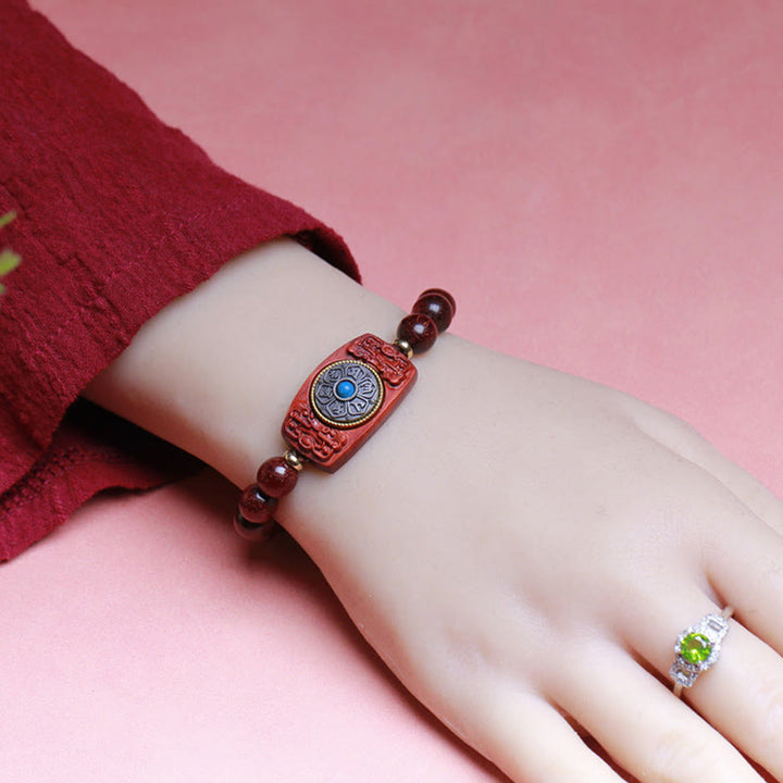 Bracelet de paix en six mots vrais en bois de santal rouge et vert avec petites feuilles de Buddha Stones