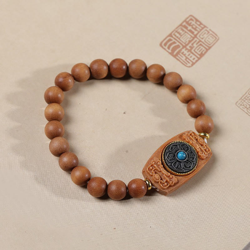 Bracelet de paix en six mots vrais en bois de santal rouge et vert avec petites feuilles de Buddha Stones