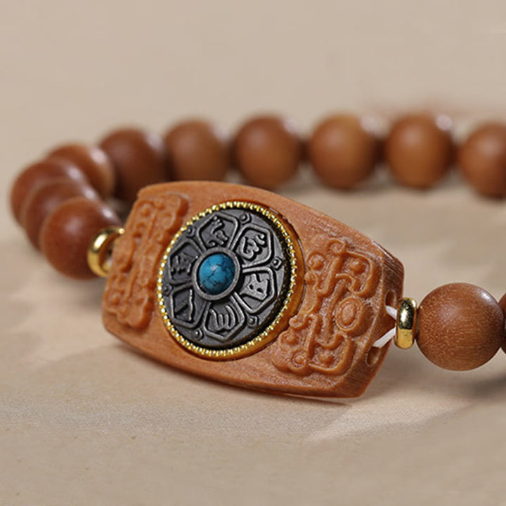 Bracelet de paix en six mots vrais en bois de santal rouge et vert avec petites feuilles de Buddha Stones