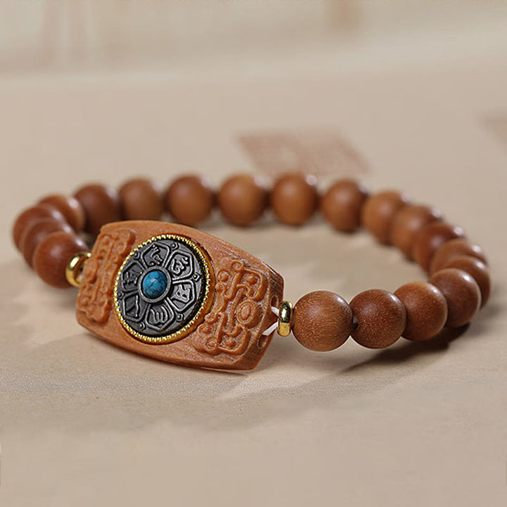 Bracelet de paix en six mots vrais en bois de santal rouge et vert avec petites feuilles de Buddha Stones