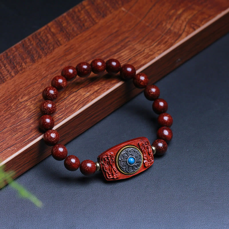 Bracelet de paix en six mots vrais en bois de santal rouge et vert avec petites feuilles de Buddha Stones