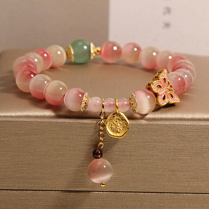Bracelet de paix œil de chat papillon rose dégradé avec Buddha Stones