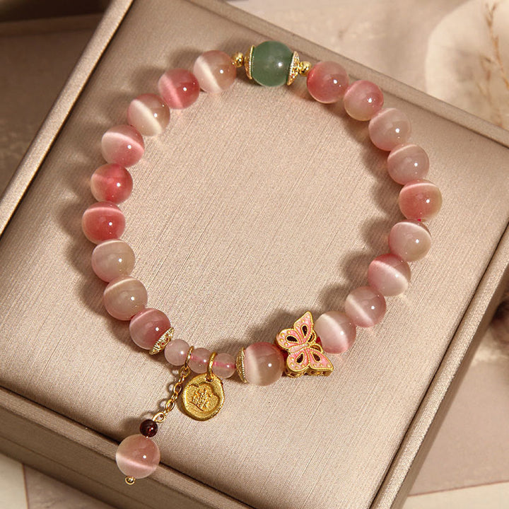 Bracelet de paix œil de chat papillon rose dégradé avec Buddha Stones
