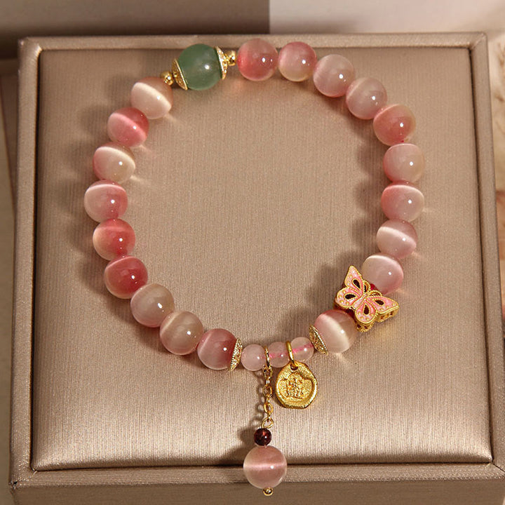 Bracelet de paix œil de chat papillon rose dégradé avec Buddha Stones