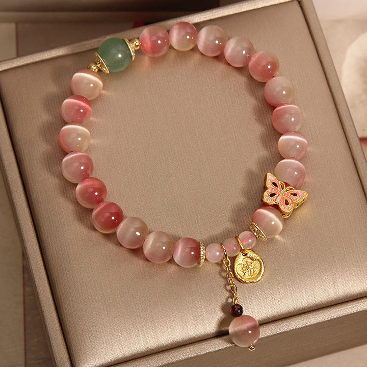 Bracelet de paix œil de chat papillon rose dégradé avec Buddha Stones