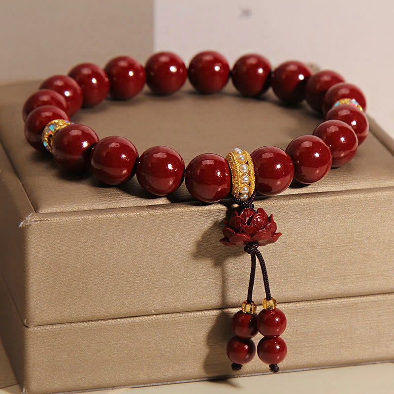 Bracelet à breloques et bénédictions de lotus en Buddha Stones et cinabre