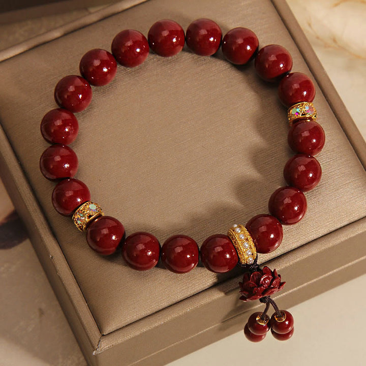 Bracelet à breloques et bénédictions de lotus en Buddha Stones et cinabre
