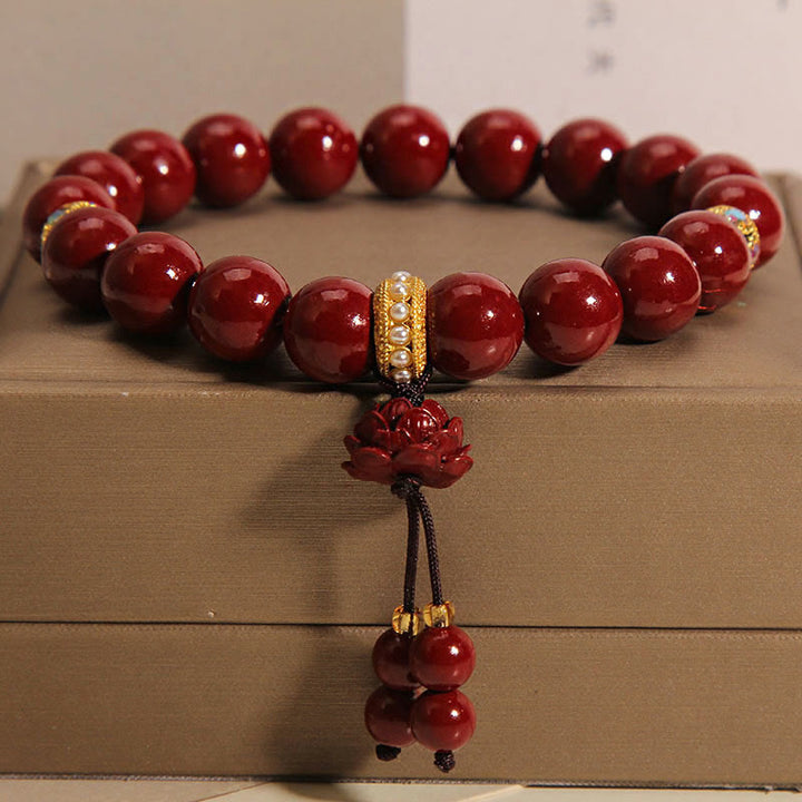 Bracelet à breloques et bénédictions de lotus en Buddha Stones et cinabre