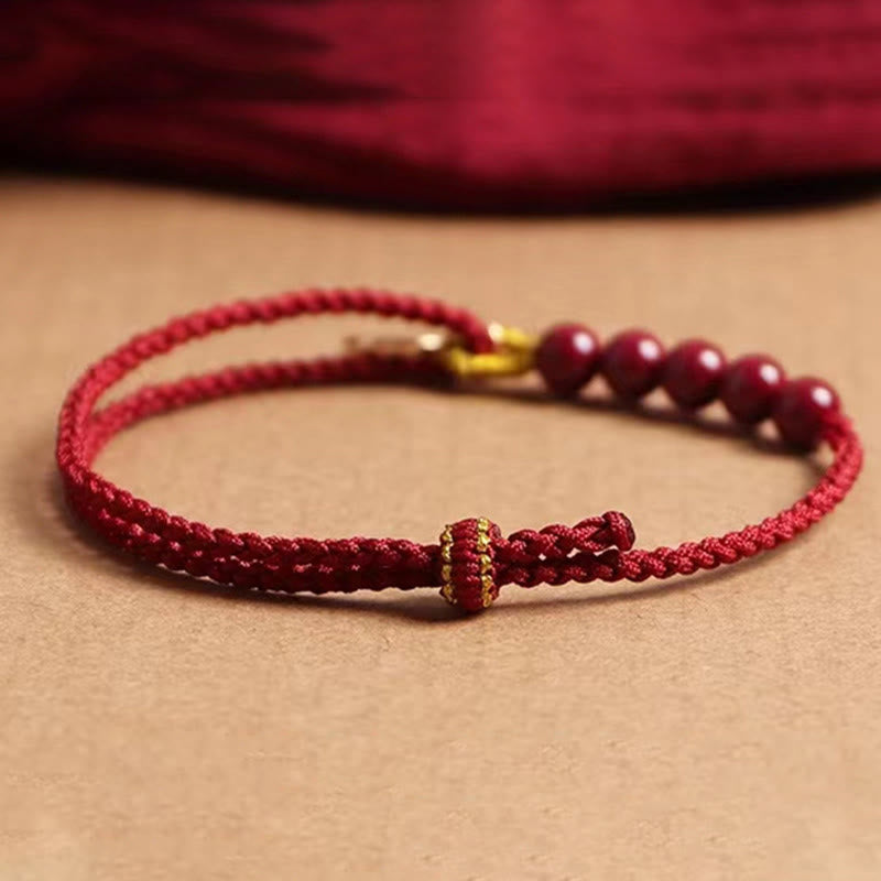 Bracelet tressé fait main en fil rouge avec Buddha Stones