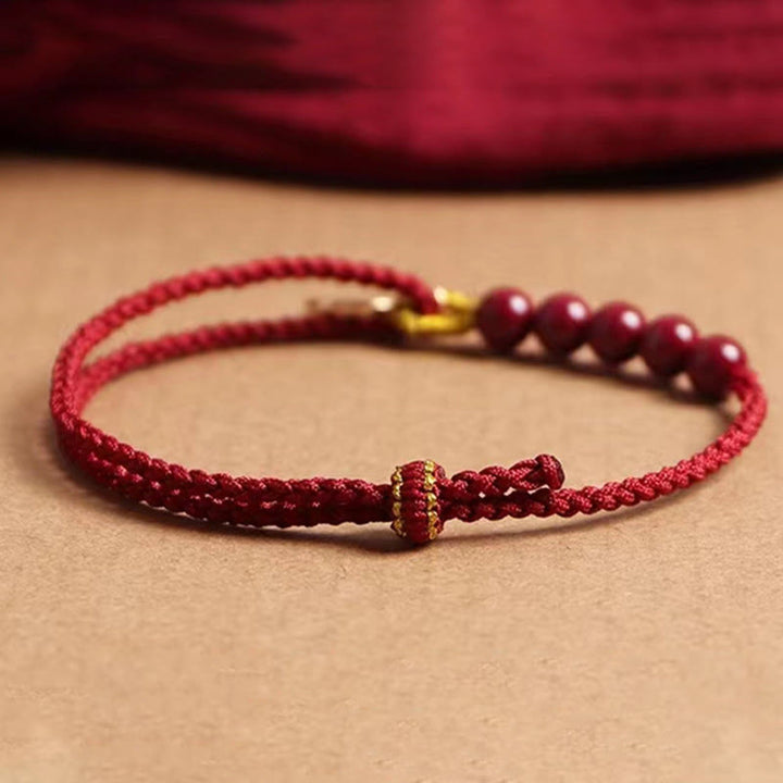 Bracelet tressé fait main en fil rouge avec Buddha Stones