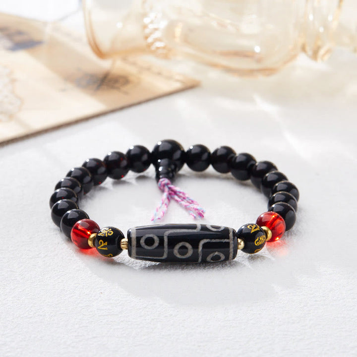 Bracelet Buddha Stones en onyx noir avec perles dzi à neuf yeux et six mots vrais
