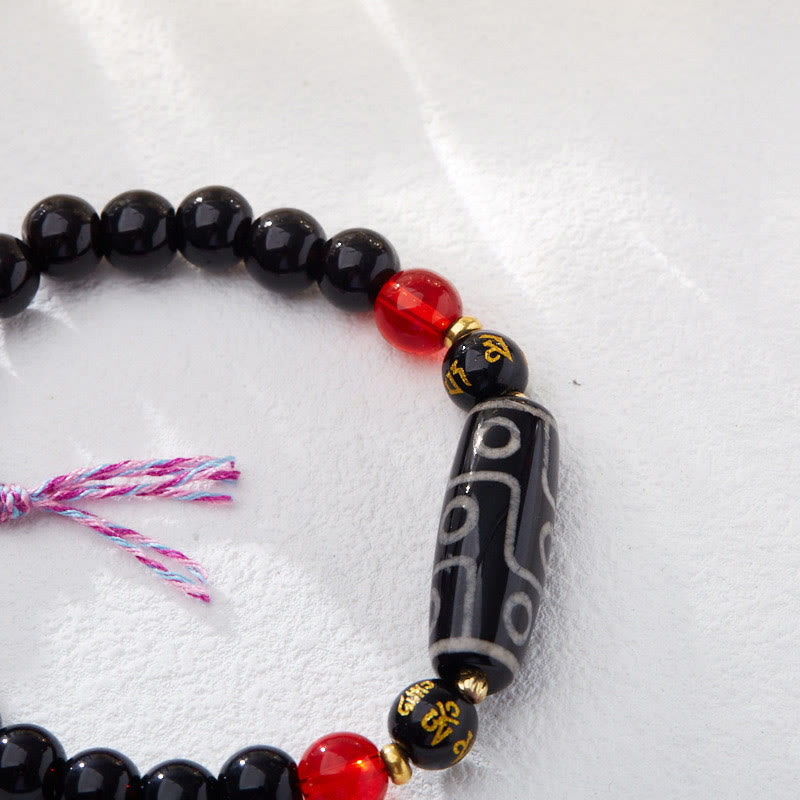 Bracelet Buddha Stones en onyx noir avec perles dzi à neuf yeux et six mots vrais