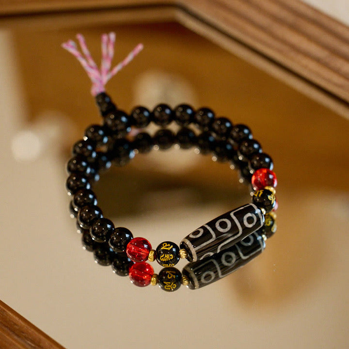Bracelet Buddha Stones en onyx noir avec perles dzi à neuf yeux et six mots vrais