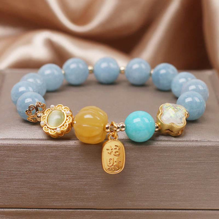 Bracelet de protection de richesse en perles de citrouille et aigue-marine de Buddha Stones