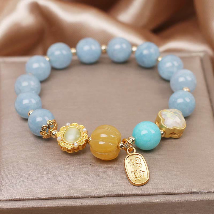 Bracelet de protection de richesse en perles de citrouille et aigue-marine de Buddha Stones