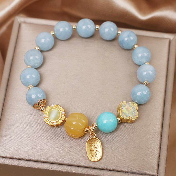 Bracelet de protection de richesse en perles de citrouille et aigue-marine de Buddha Stones
