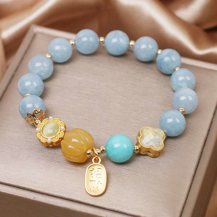 Bracelet de protection de richesse en perles de citrouille et aigue-marine de Buddha Stones