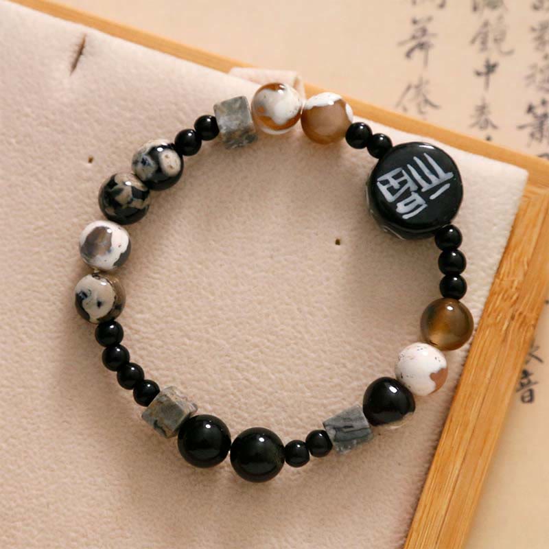 Bracelet en Buddha Stones avec onyx noir, céramique, agate, pierre noire scintillante, personnage de Fortune Fu