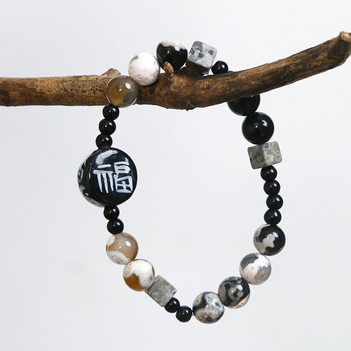 Bracelet en Buddha Stones avec onyx noir, céramique, agate, pierre noire scintillante, personnage de Fortune Fu