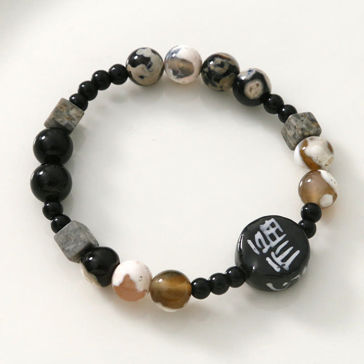Bracelet en Buddha Stones avec onyx noir, céramique, agate, pierre noire scintillante, personnage de Fortune Fu