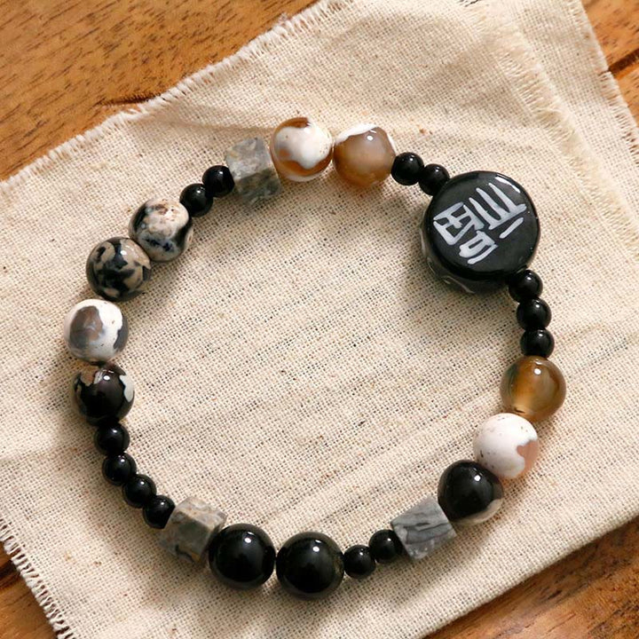 Bracelet en Buddha Stones avec onyx noir, céramique, agate, pierre noire scintillante, personnage de Fortune Fu
