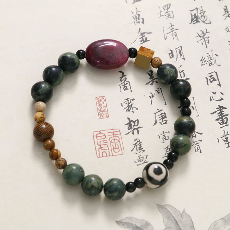 Bracelet de puissance et de succès en perles dzi à trois yeux en agate verte de Buddha Stones