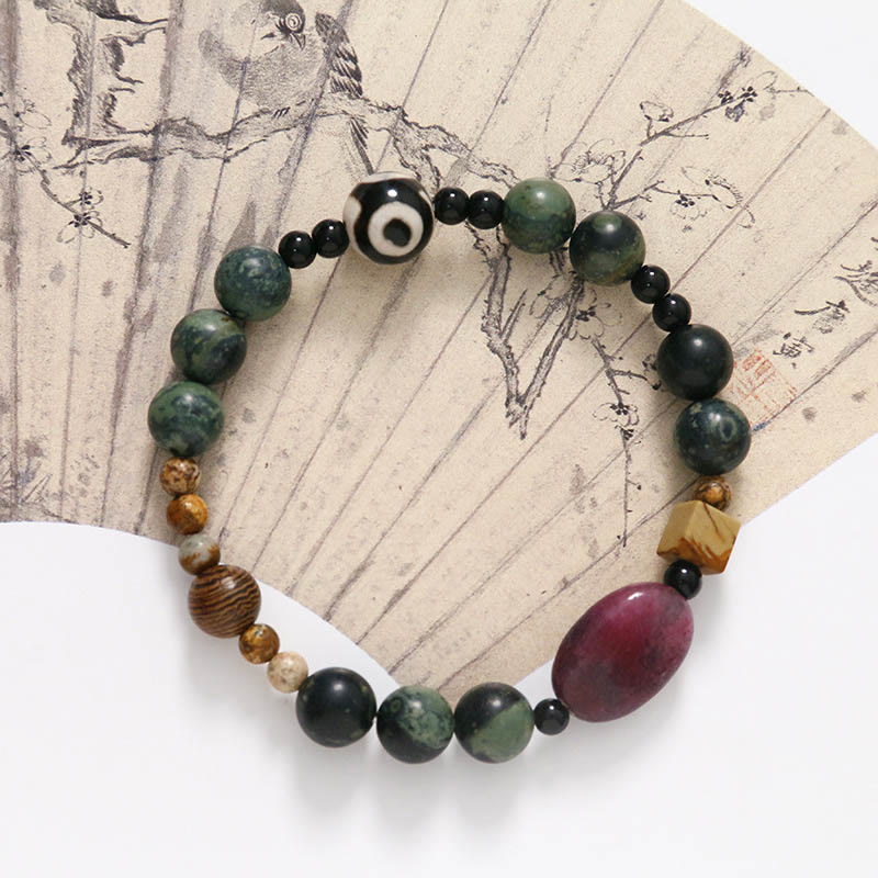 Bracelet de puissance et de succès en perles dzi à trois yeux en agate verte de Buddha Stones