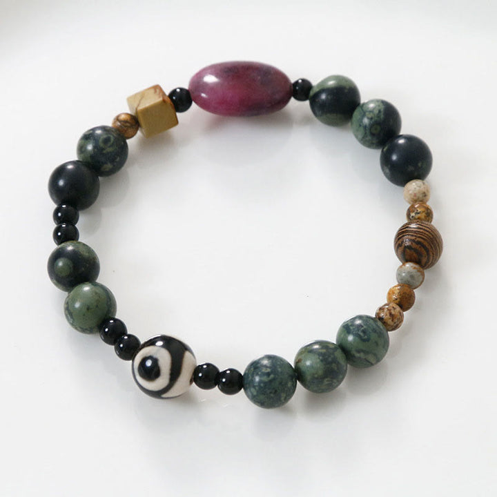 Bracelet de puissance et de succès en perles dzi à trois yeux en agate verte de Buddha Stones