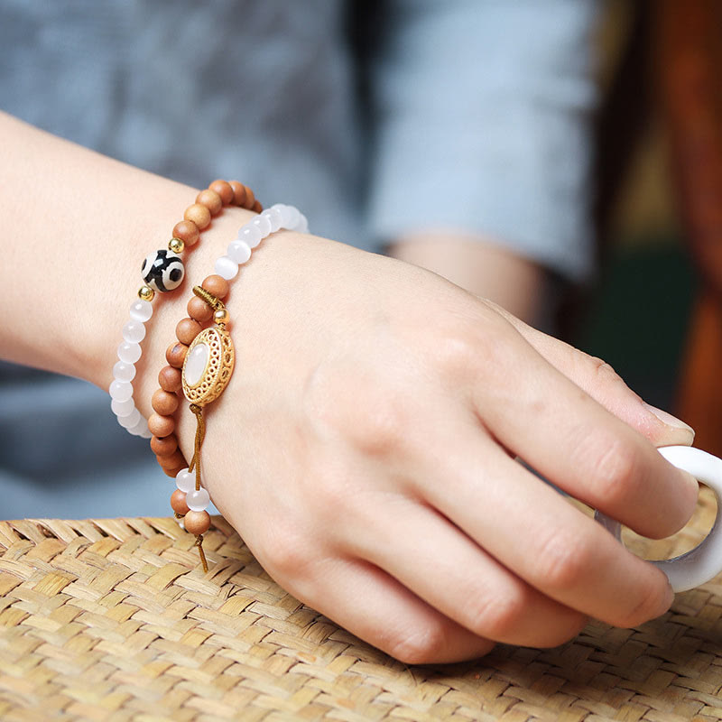 Bracelet de protection en cristal avec perles Dzi à trois yeux en œil de chat et bois de Buddha Stones