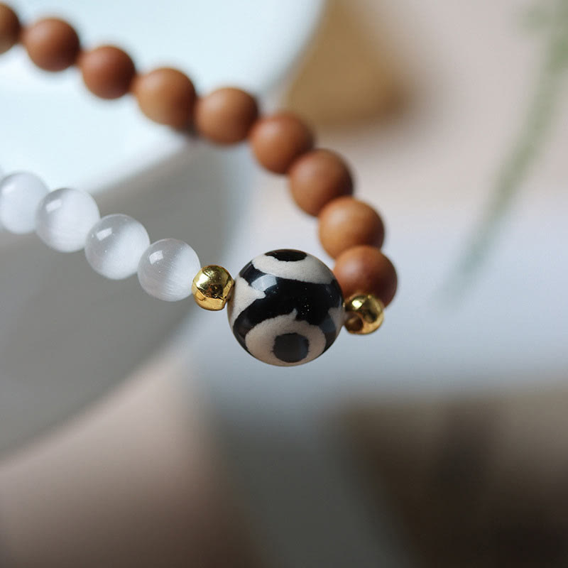 Bracelet de protection en cristal avec perles Dzi à trois yeux en œil de chat et bois de Buddha Stones