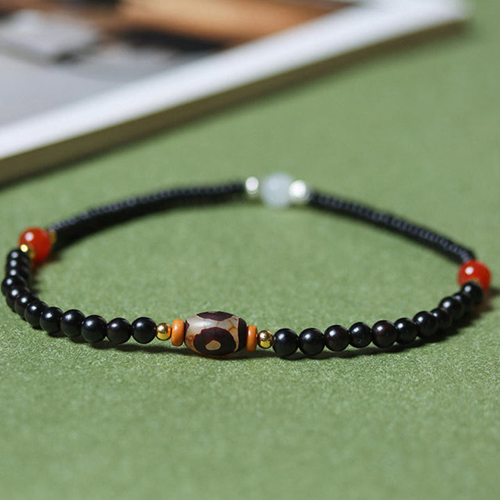 Bracelet double tour en perles de santal et dzi en ébène et bois de santal vert Buddha Stones