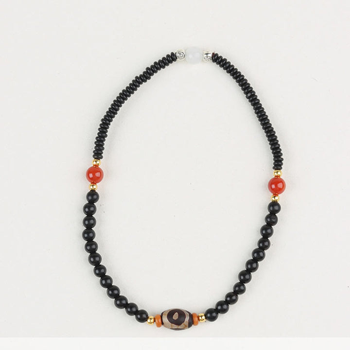 Bracelet double tour en perles de santal et dzi en ébène et bois de santal vert Buddha Stones