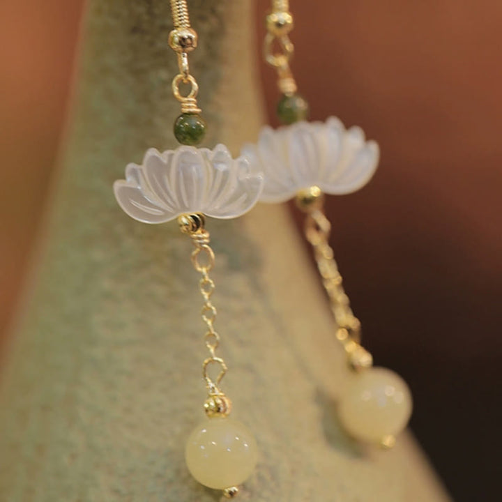 Boucles d'oreilles en jade Hetian avec Buddha Stones et lotus de prospérité