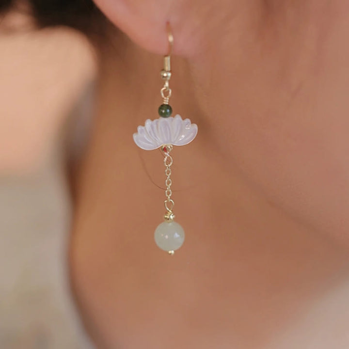 Boucles d'oreilles en jade Hetian avec Buddha Stones et lotus de prospérité