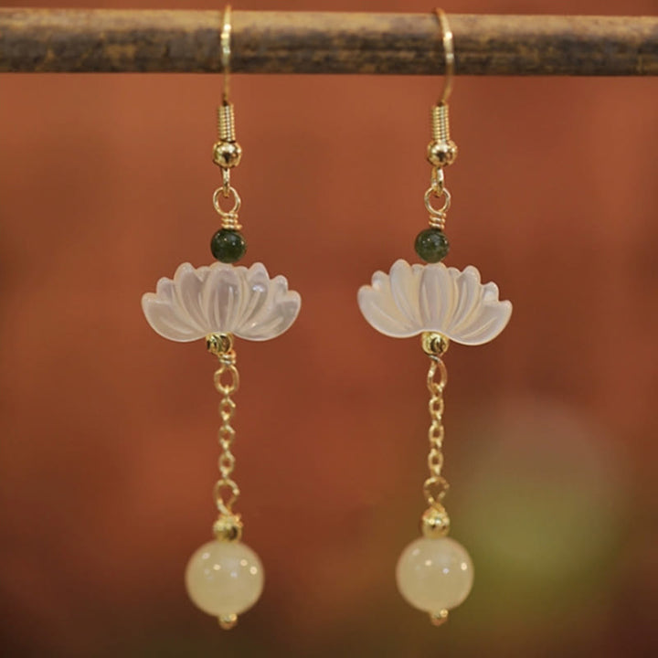 Boucles d'oreilles en jade Hetian avec Buddha Stones et lotus de prospérité